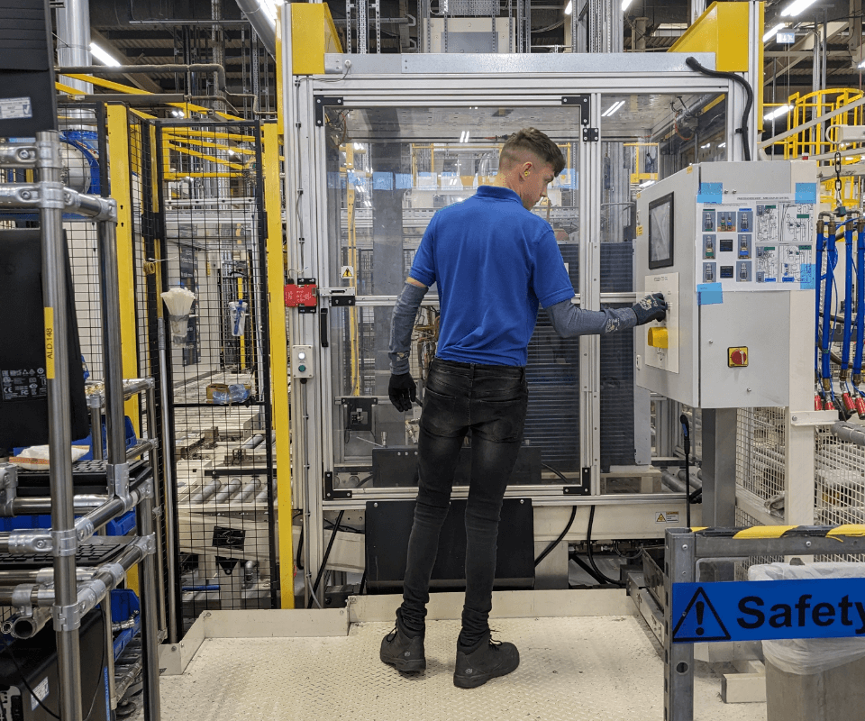 A mitsubishi electric employee working in the factory